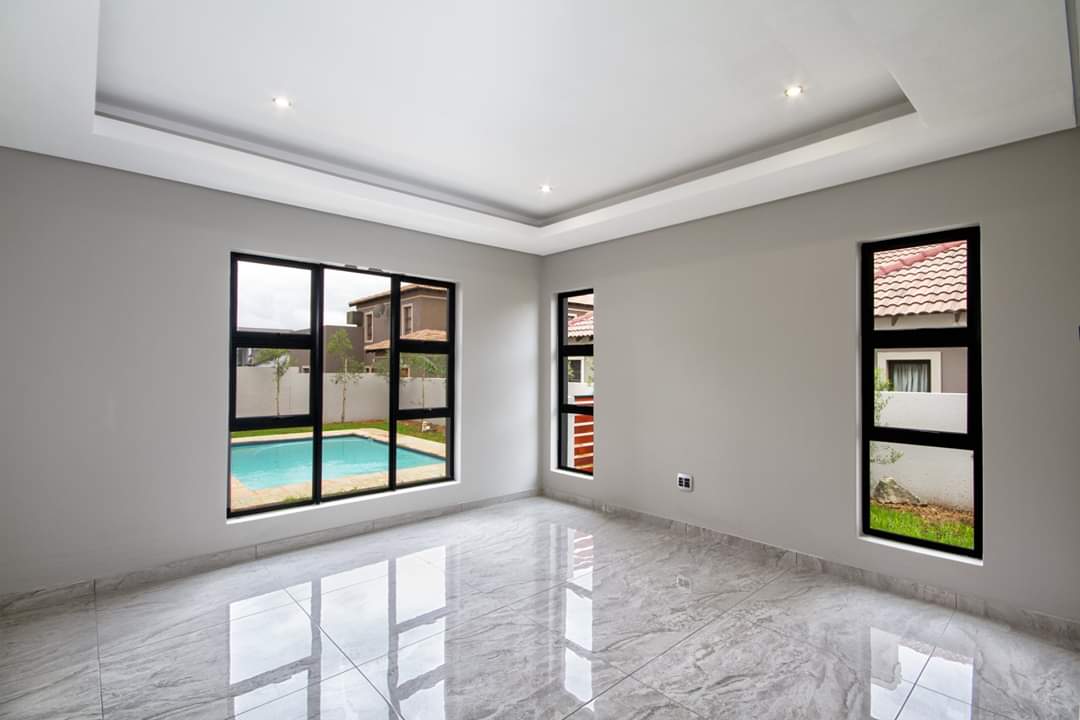 Renovated open-plan living area with pool view