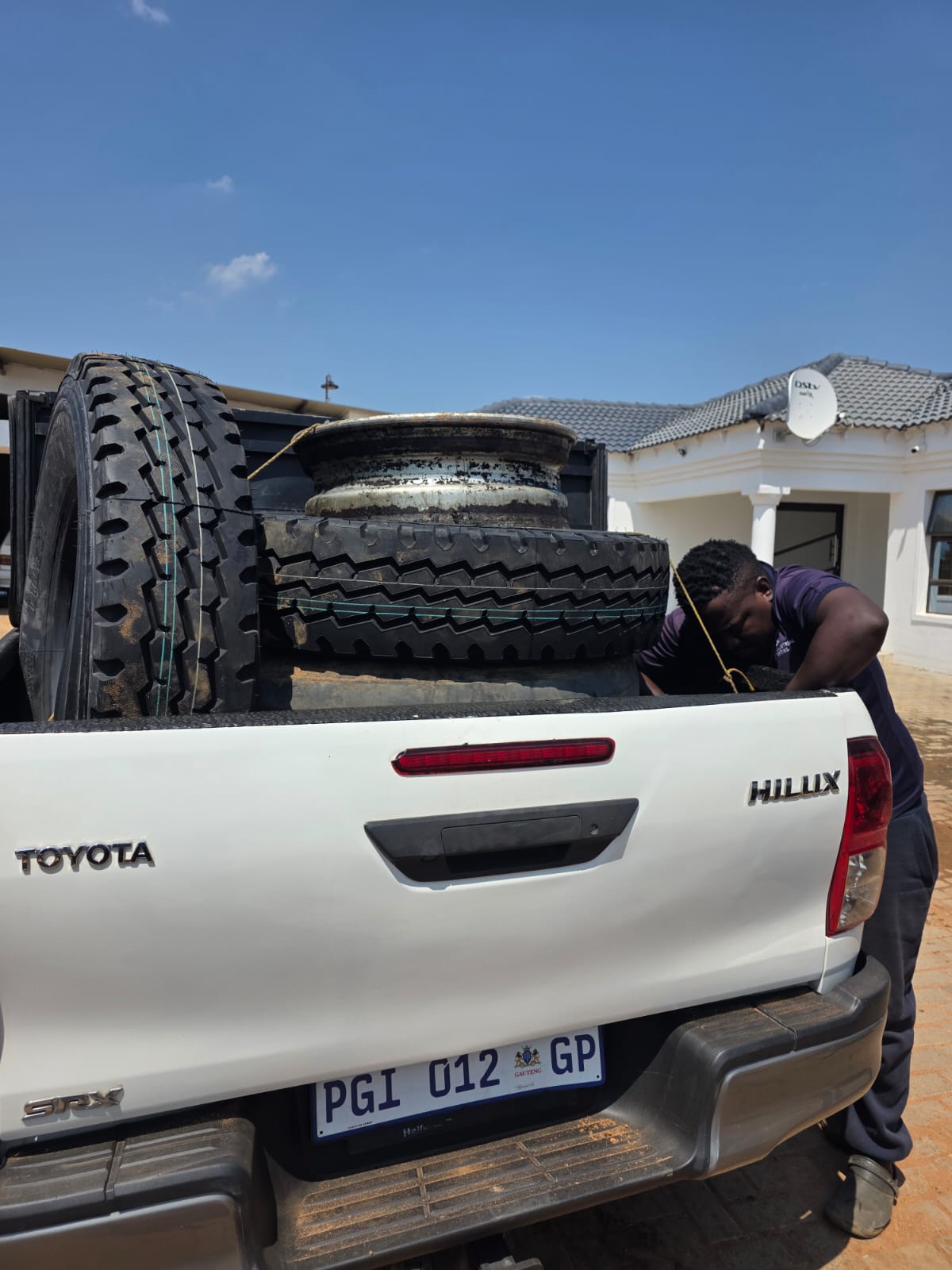 Water tanker delivering water to a community during a supply interruption